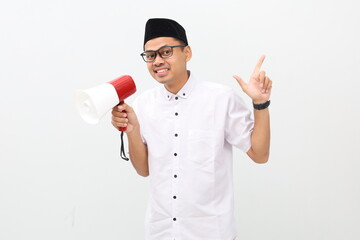 Fototapeta premium Asian muslim man with finger gesture pointing making announcement megaphone. Isolated on white