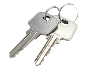 Two metal keys on a keyring, angled slightly on a black background