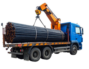 Truck transports hefty load of steel bars, secured and lifted by an orange crane, against a dark backdrop