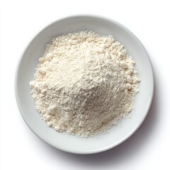 Overhead view of finely textured light powder in a simple white ceramic bowl Isolated on a bright white background
