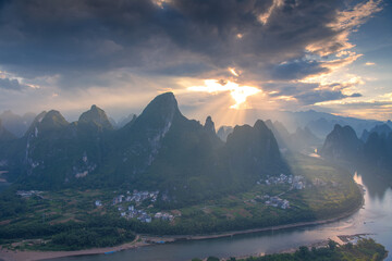 Panoramic sunrise over the Karst mountain natural landscape from Xianggong Mountain, with cloudy sky.