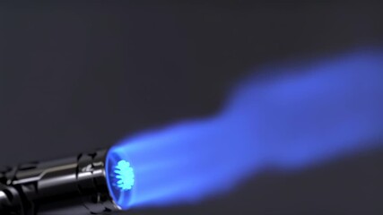 Close up of a blowtorch with a bright blue flame against a dark background - Powered by Adobe