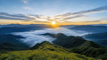 Obraz premium Majestic dawn sky with soft light illuminating mountains and clouds below, creating serene