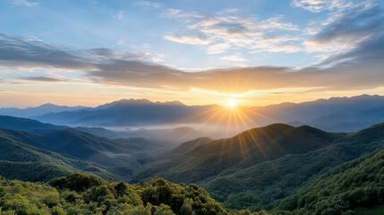 Obraz premium Breathtaking mountain landscape dawn with sun rising over peaks, illuminating valleys and hills