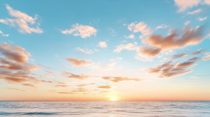 Obraz premium Soft dreamy pastel sunset sky with warm glow reflecting on calm ocean waves