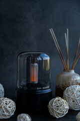 Indoors Decoration with modern lighted Air Humidification Aroma essential oil perfume fragrance. Scented home wellness wellbeing habit. Concept of feeling good spiritual health and being mindful