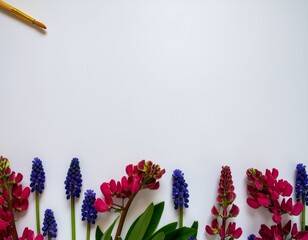 Creative Floral Composition with Paintbrush and Red Flowers