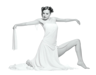 Woman draped in white fabric, posing elegantly on a black background, seated with legs bent and arms outstretched