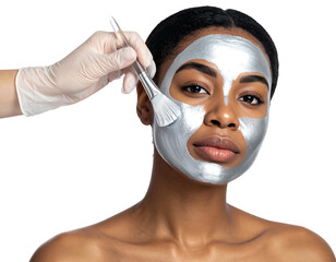 Woman getting a silver mask applied to her face with a brush, skin treatment, beauty procedure
