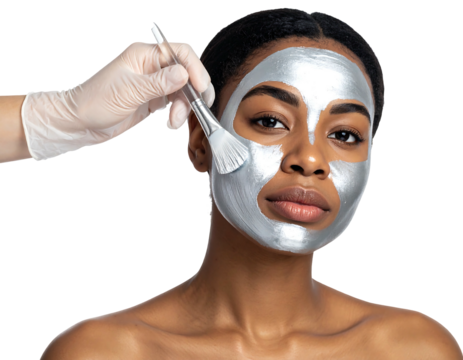 Woman getting a silver mask applied to her face with a brush, skin treatment, beauty procedure