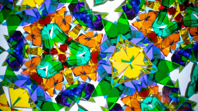 Stunning macro photograph of a natural kaleidoscope pattern showcasing vibrant colors, geometric design, and light reflections, shot with a camera.