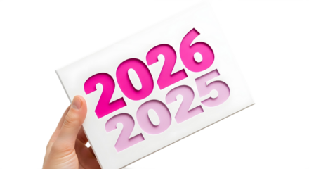 Hand holds pink “2026” over “2025” — soft symbol of new year transition and hope.