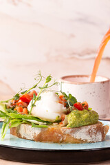 Bruschetta with poached egg on a plate.