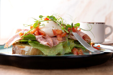 Bruschetta with poached egg on a plate.