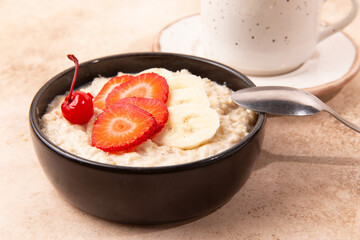 Milk porridge with berries and banana.