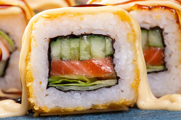 Cucumber and salmon roll. Close-up.