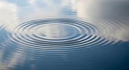 Fototapeta premium Macro Photo of Water Ripple in Calm Pond Reflecting the Sky