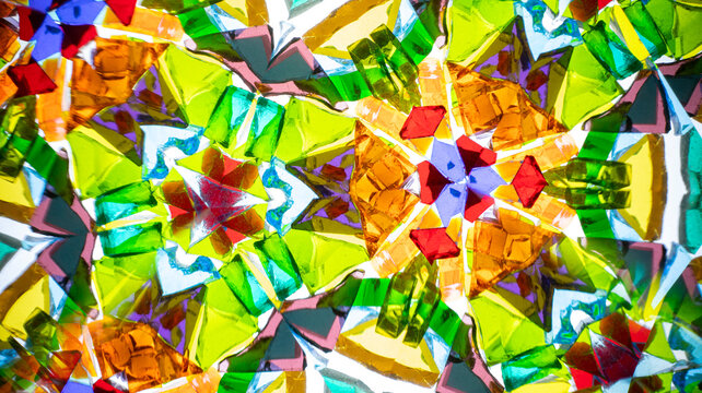 Stunning macro photograph of a natural kaleidoscope pattern, showcasing vibrant colored glass and light reflections.