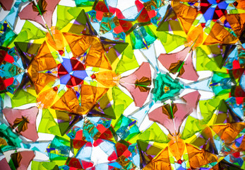 Stunning macro photograph of a natural kaleidoscope pattern, showcasing vibrant colored glass and...
