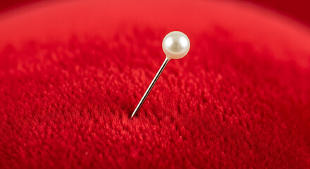 Pearl head pin on red velvet sewing tailoring craft