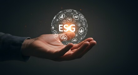 Hand Holding Glowing ESG Sphere with Icons Sustainability Concept Dark Background.