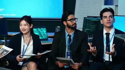 Diverse professional team collaborating in a modern tech office, analyzing data on computers and sharing innovative ideas. Teamwork, IT development, and successful global enterprise - Powered by Adobe