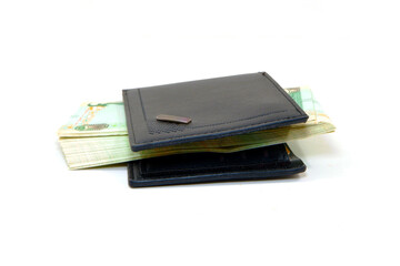 Black leather wallet with currency notes closeup view 