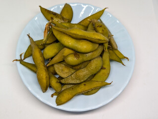 Close-up of Plate of Cooked Edamame A Healthy and Flavorful Snack