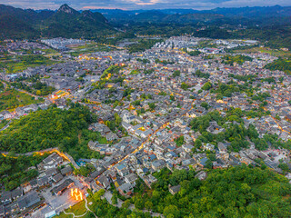 Hills and houses of Qingyan Ancient Town, one of the top 4th famous old towns and popular travel destination in Guizhou Province, China, aerial drone shot