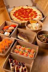 Pizza, rolls, and pasta ready for delivery.