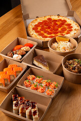 Pizza, rolls, and pasta ready for delivery.