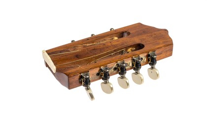 Close-up of a wooden guitar headstock with tuning pegs, isolated on white