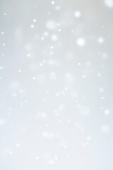 Fototapeta premium Soft, glowing particles, gentle light bokeh, and subtle sparkles floating in the air. Minimalist ethereal design with a dreamy, luminous, and elegant atmosphere