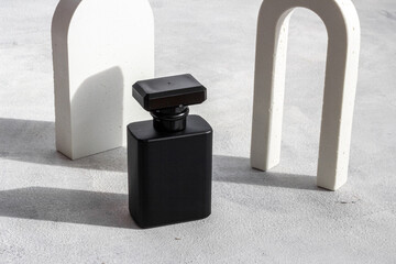 Black man perfume bottle close up. Male fragrance concept