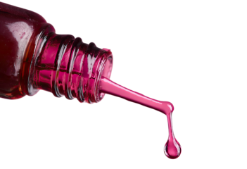 Dripping pink nail polish from bottle against a stark black backdrop