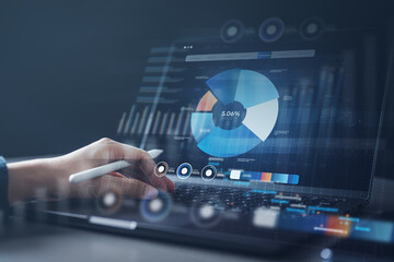 Hand using a stylus to interact with digital pie charts and analytics on a laptop, symbolizing marketing funnel performance, CRM data, and conversion insights for business growth.