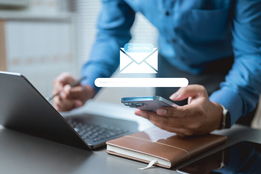 newsletter, signup, form, email, A business person using smartphone and laptop with email subscribe form interface, representing newsletter signup, digital marketing, and online customer engagement.