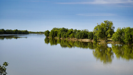 Normanton North Queensland,Serene River Scene With Reflections Of Green Trees And Clear Blue Sky