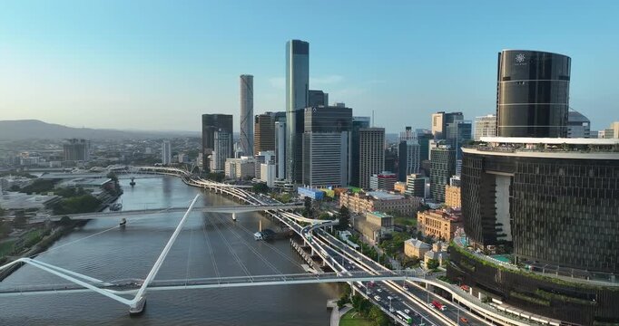 4K Aerial Panning right to left view of west Brisbane CBD  called South Bank Precinct with new buildings and new pedestrian bridge called Neville Bonner Bridge, Brisbane, QLD, Australia