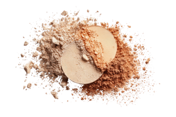 Powder makeup with fair and tan shades spilled on a black backdrop