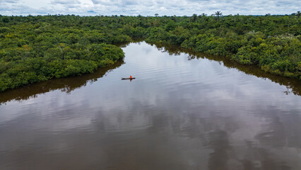 Drone image of the Nanay River in the Amazon rainforest of Iquitos, Peru  a blackwater (igapó)...