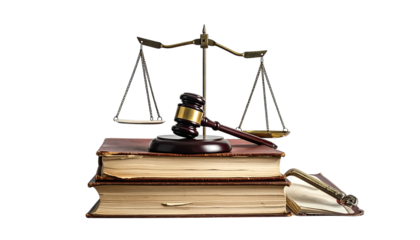 Gavel and scales resting atop stacked antique law books