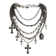 Intricate silver necklace of crosses and chains on dark background