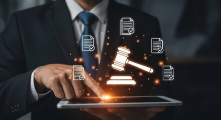 Lawyer's hand touching a tablet with glowing legal documents and gavel