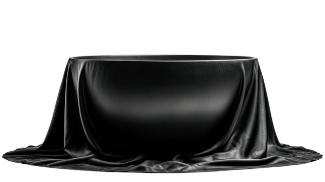 Black draped table against black backdrop