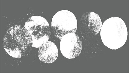 Abstract arrangement of textured white circles on solid gray background with scattered speckles.