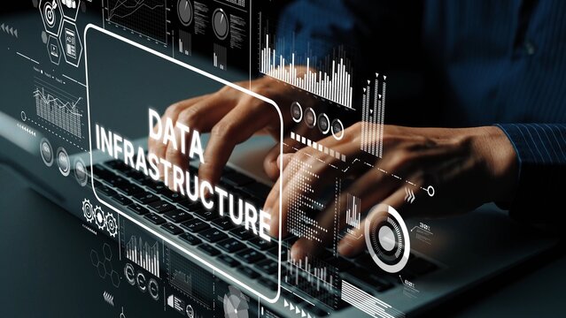 Hands Typing on Laptop with Data Infrastructure Graphics Overlaid for Tech and Digital Concepts. Asymptotic smart data analytic.