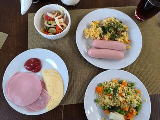 morning breakfast with boiled sausages and omelette. healthy eating concept