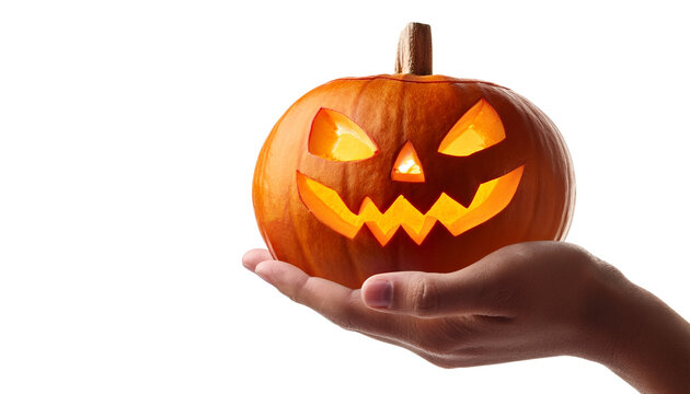 Hand holding scary Halloween pumpkin or jack o lantern pumpkin on a whiite surface