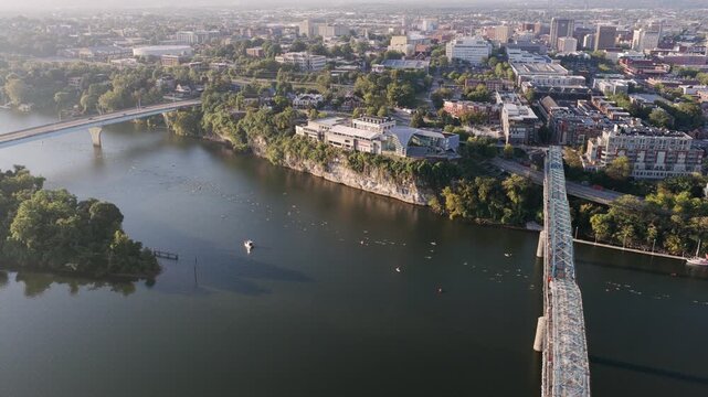 Drone shot captures swimmers moving downstream past Chattanooga&rsquo;s iconic bridges and bluffs during the Ironman race.